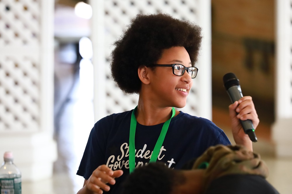 This is an image of Two National Teen Board members hugging and smiling at the camera.